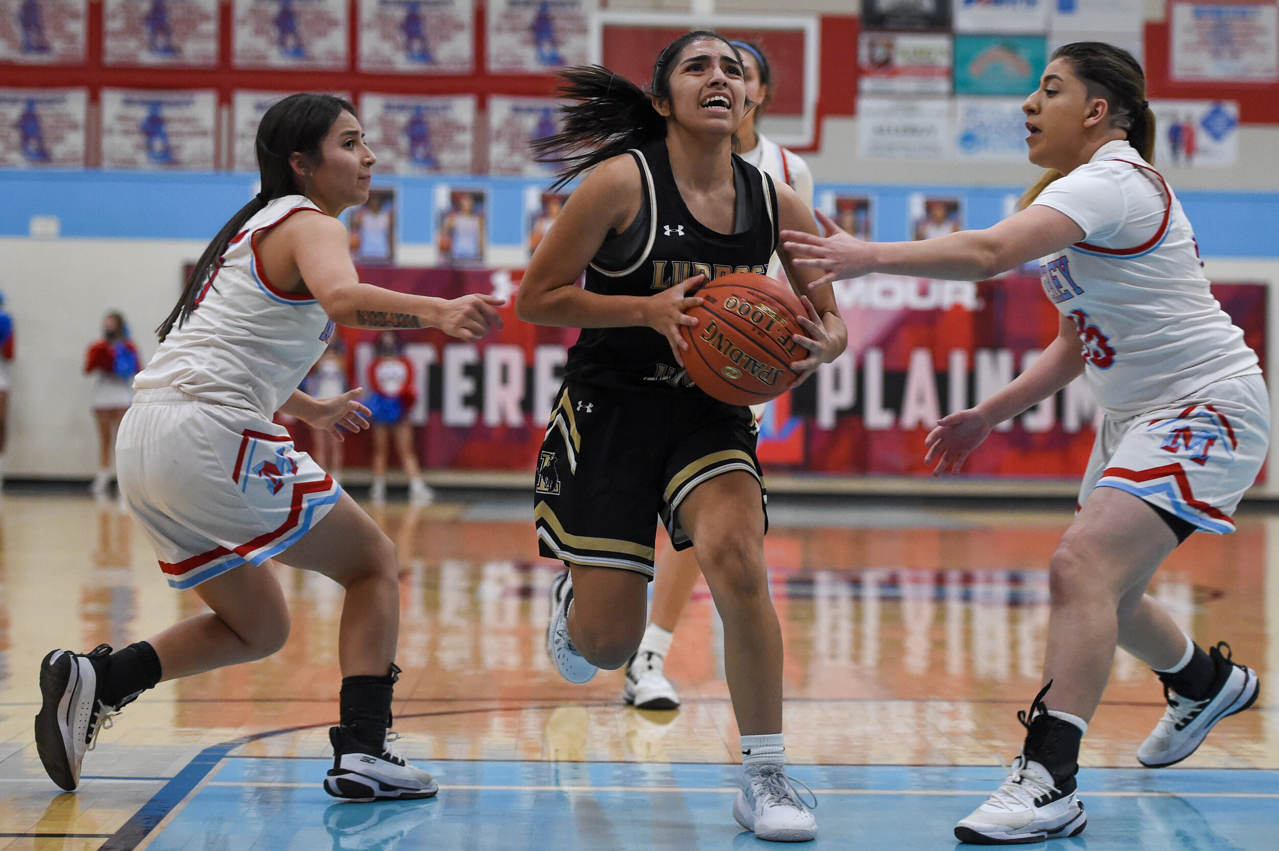  Lubbock’s Ciara Hernandez drives the ball into the pain during the basketball game against Monterey on Friday, Feb. 5, 2021, at Monterey High School in Lubbock, Texas.  