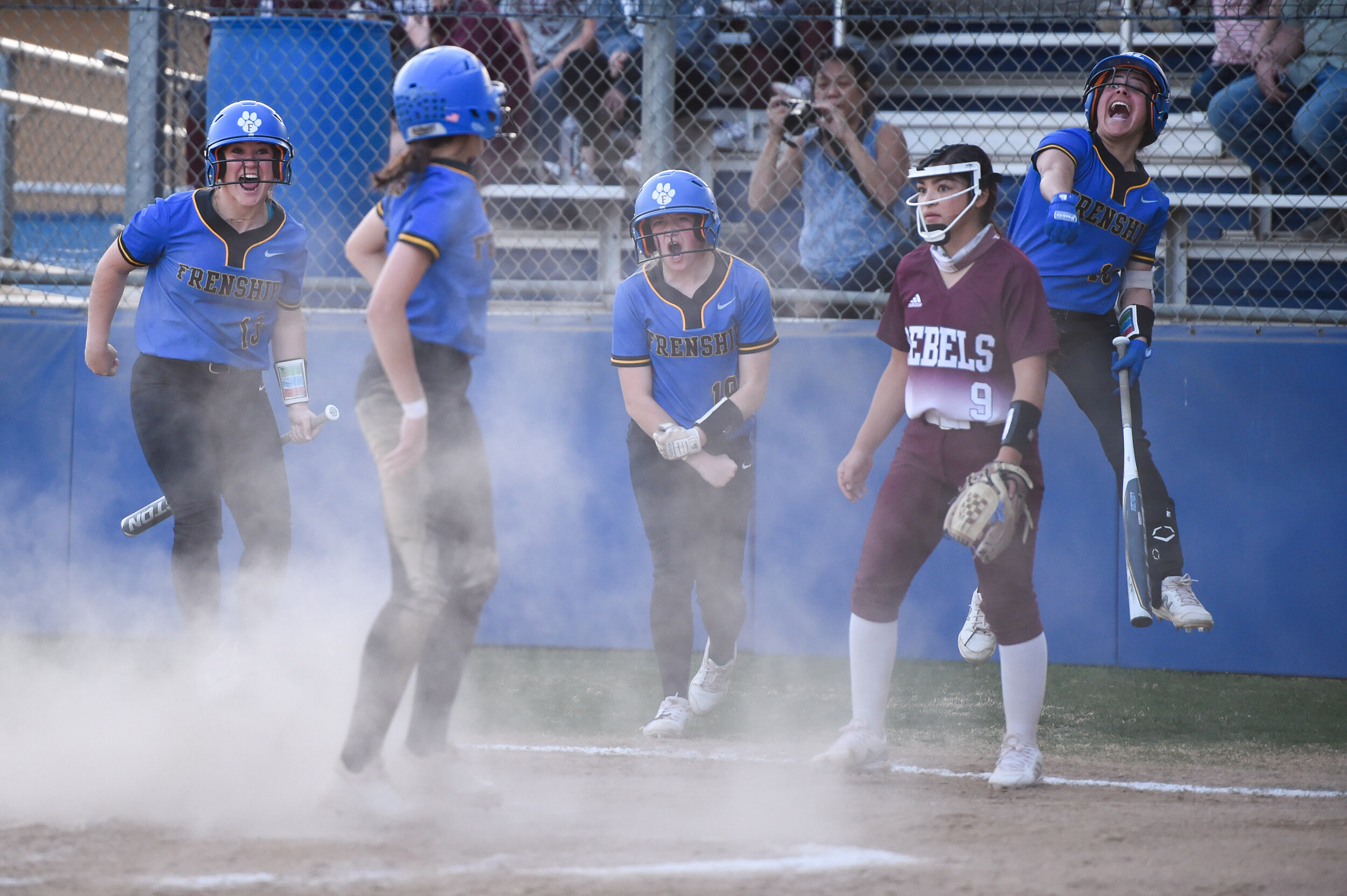  The Frenship Tigers softball team celebrates after scoring a three-run inside the park home run during the softball game against Midland Lee on Tuesday, March 16, 2021, at Frenship High School in Wolfforth, Texas.  