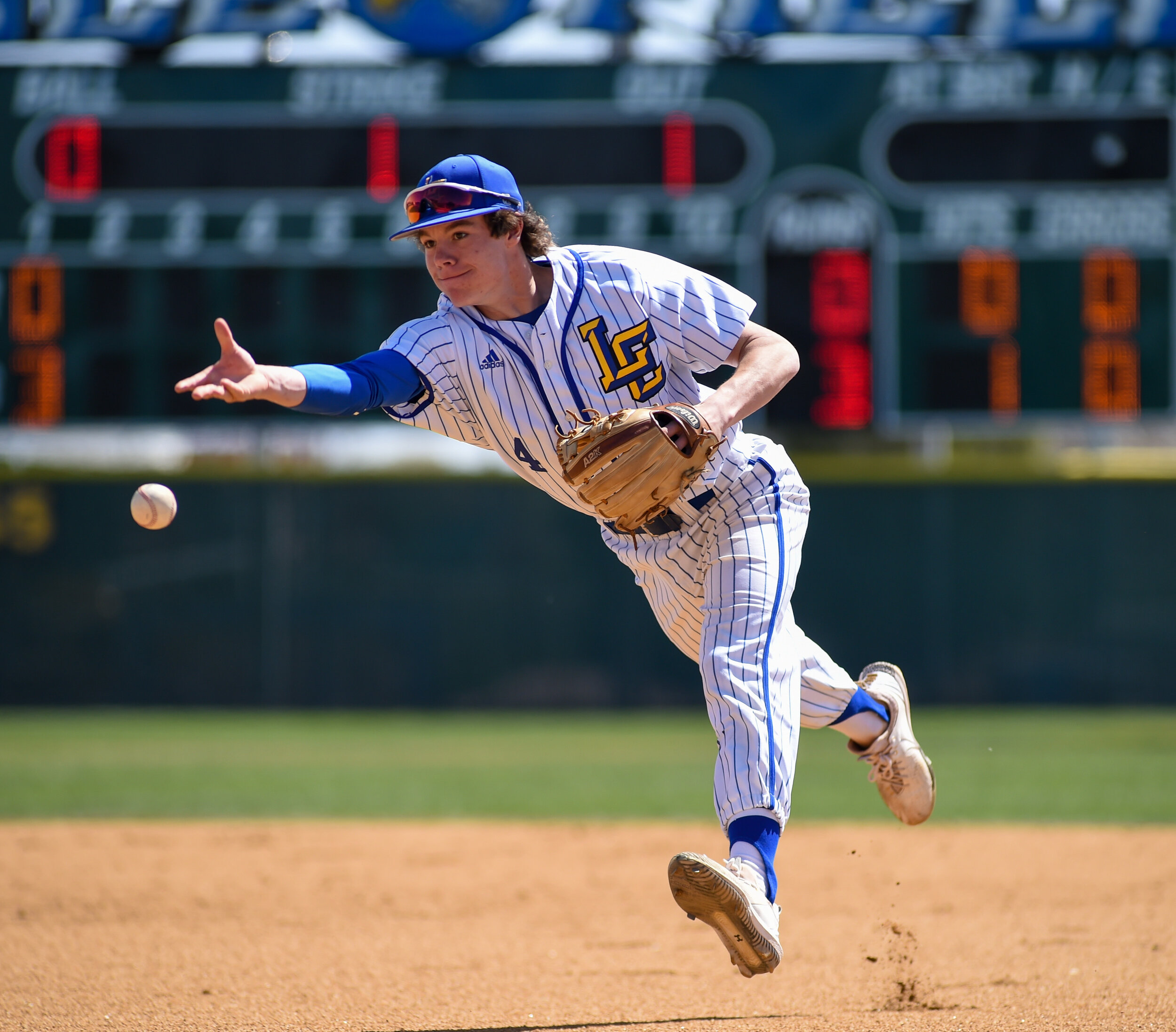  Lubbock Christian’s Jackson Leatherwood tosses the ball to first in the baseball game against Fort Worth on Saturday, March 27, 2021 at Lubbock Christian High School in Lubbock, Texas.  