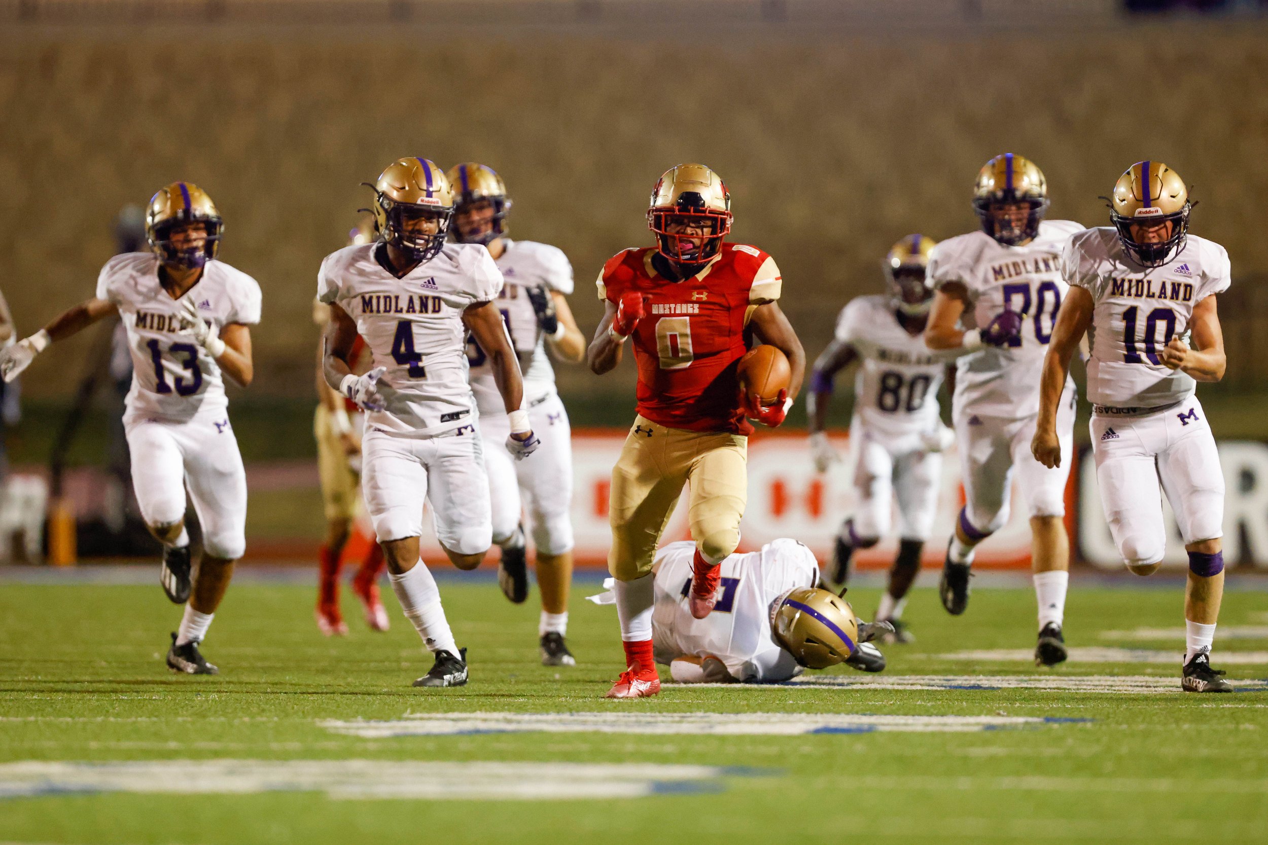  Coronado’s Antonio Malone (0) runs the ball during the second half of the team’s high school football game against Midland on Thursday, Sept. 16, 2021 at Lowrey Field at Plains Capital Park in Lubbock, Texas. 