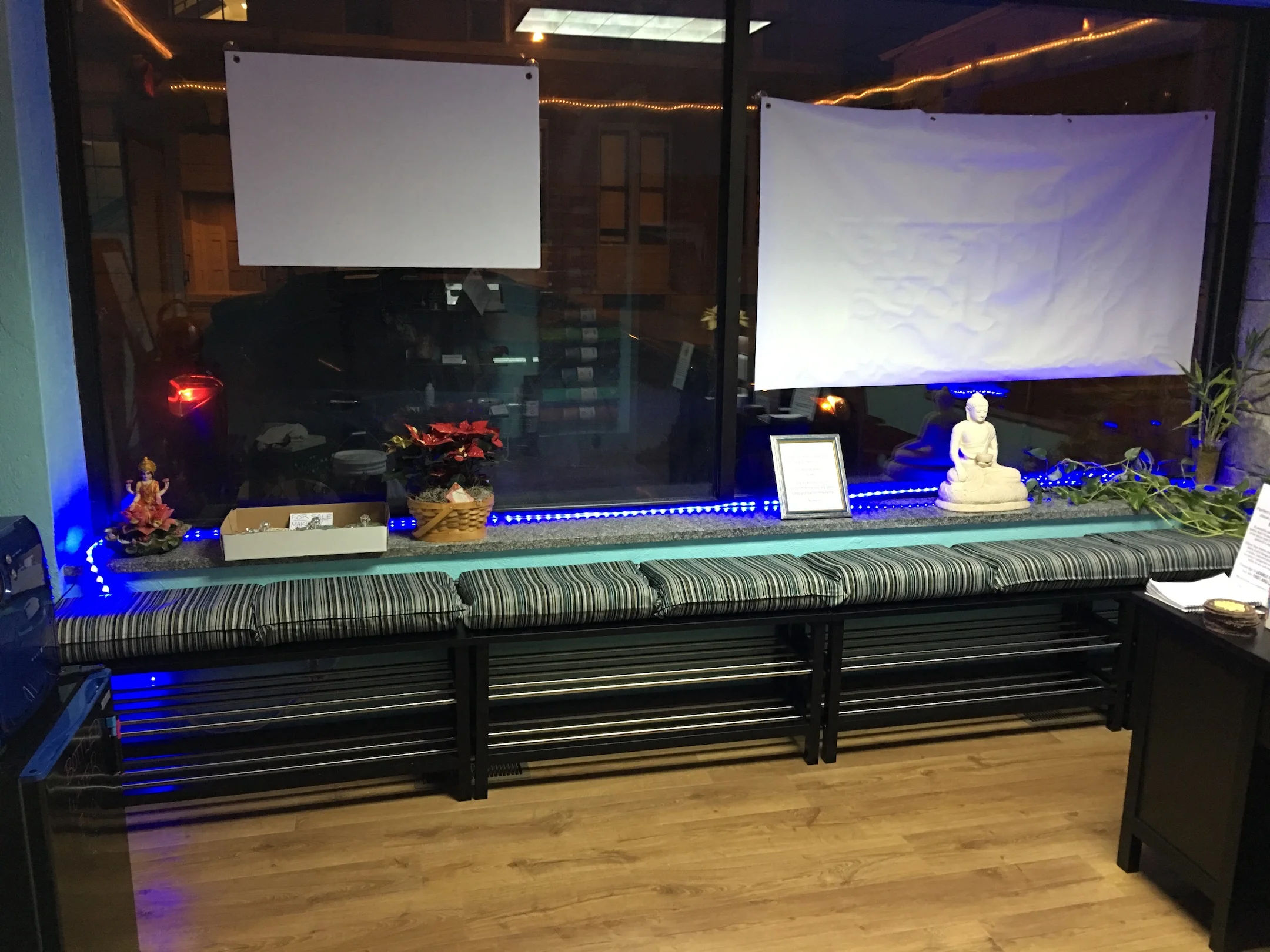 Lobby seating and shoe storage at night