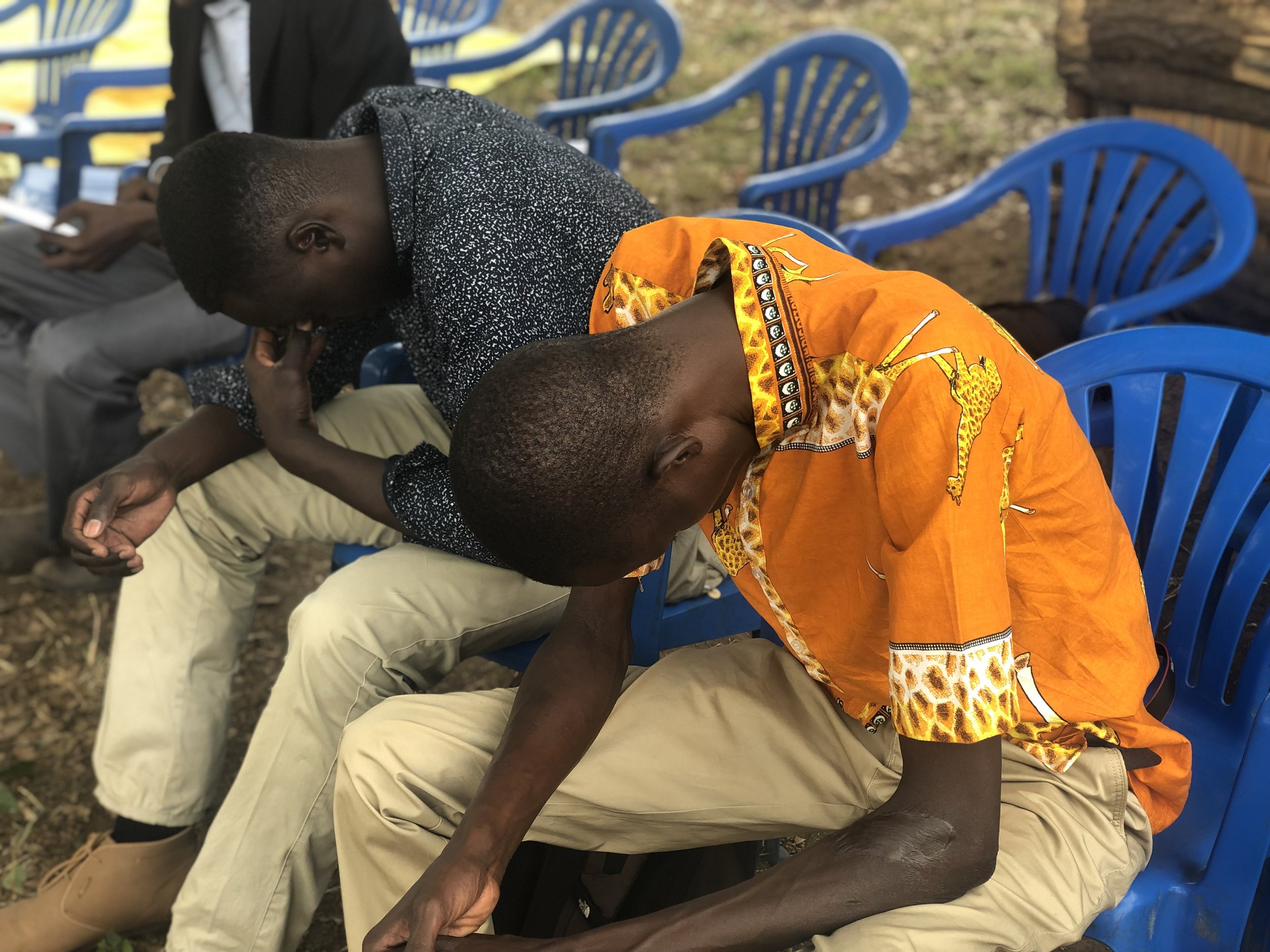 Pastors Ocen and Shadrach (Lubangakene Bible Church) praying during the 1-year church anniversary celebration at The Word Community Church