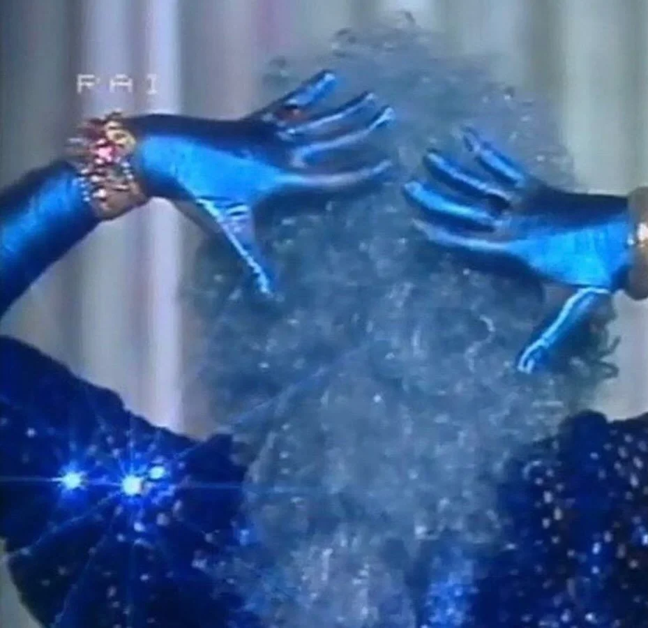 Image via @eastbirdwestbird &mdash; 

Aquarian blue. A shocking revolution song. Blue gloves. Metallic opportunity. We watched lightning&mdash;like the 1970s, but new. Who are we? How do we move subtly?

Dish rags and AI weapons, cult dynamics, and t