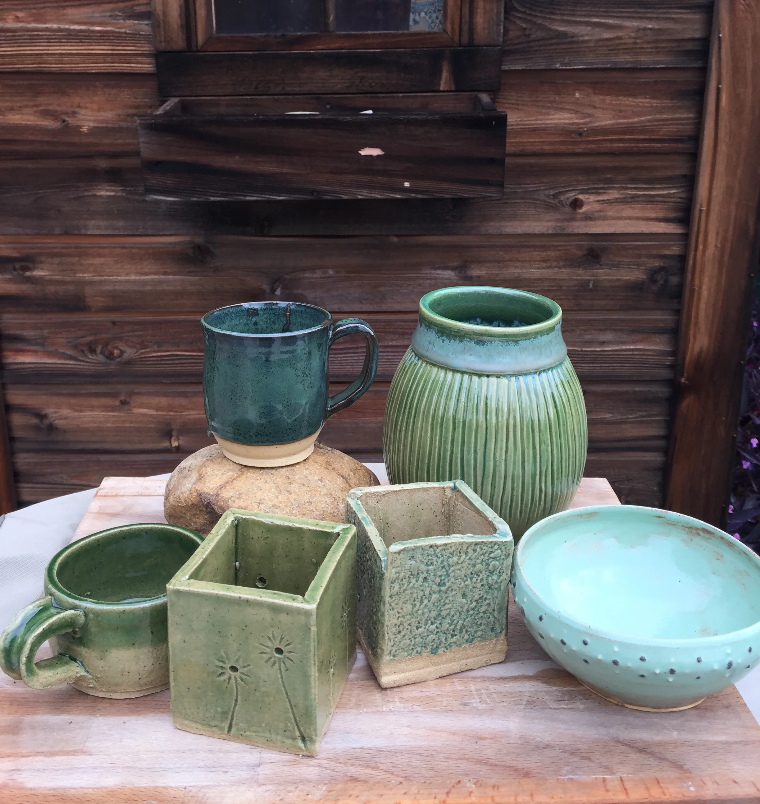 Amaco True Celadon, Coyote Pistachio Shino, Coyote Pam’s Green, Laguna Cerulean, Coyote Gunmetal Green. Work by studio members and students.