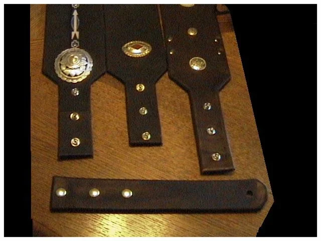 The above picture represents my newest design called the "Snap Strap Extender" which allows adjustment a couple inches each way, 75% of all my straps are built this way, or you can order a full length one piece design custom fit to your current strap length. 
