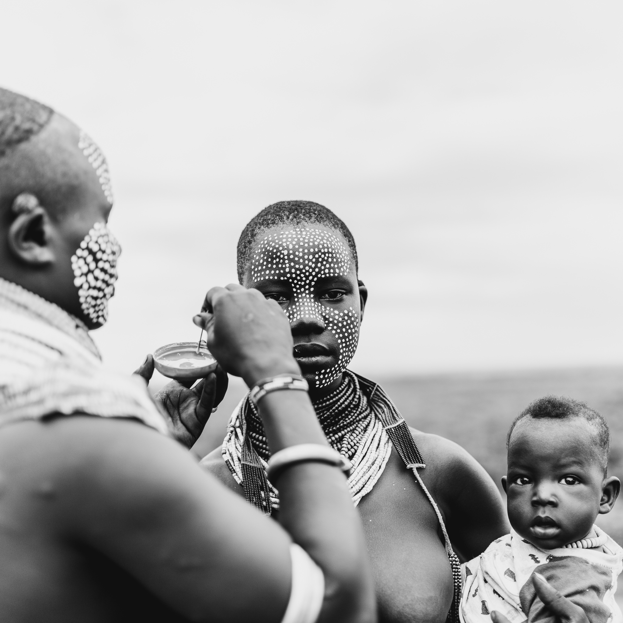 The Karo tribe are known for their distinct face and body painting. Each design is unique but is always done by someone else.