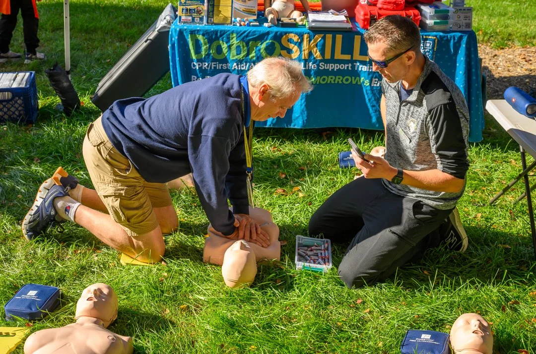 Bobby of DobroSKILLS assists student with hands-only CPR training
