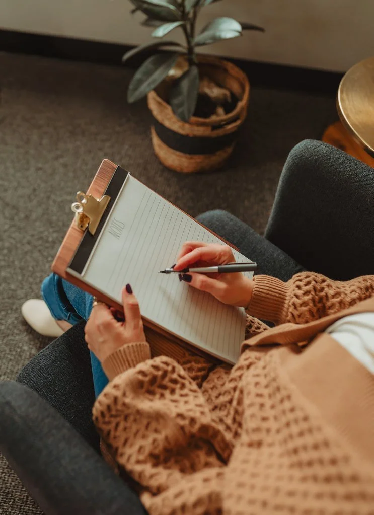 Overhead view of a person holding a notepad