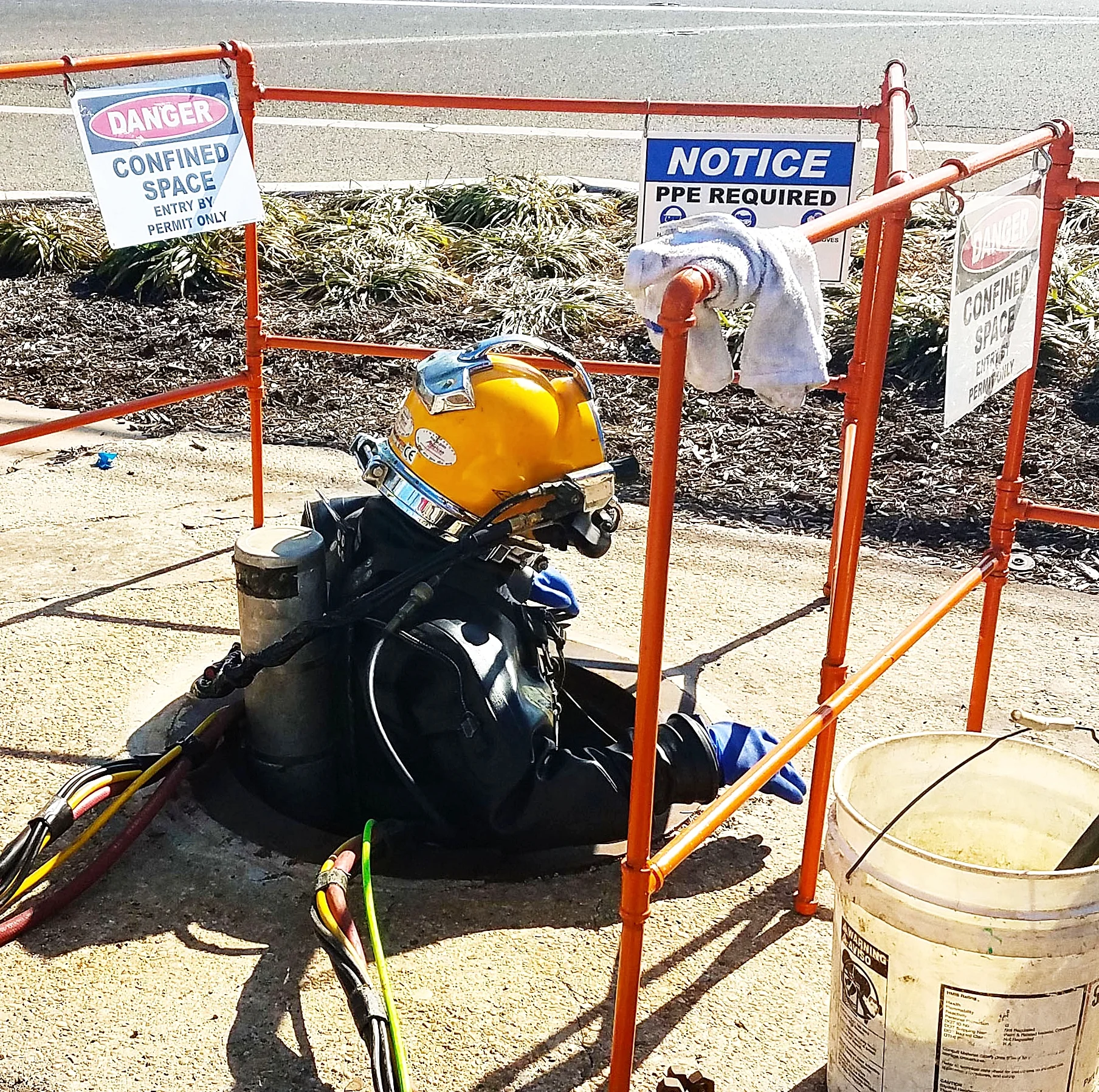 MUA diver entering sewer for inspection.