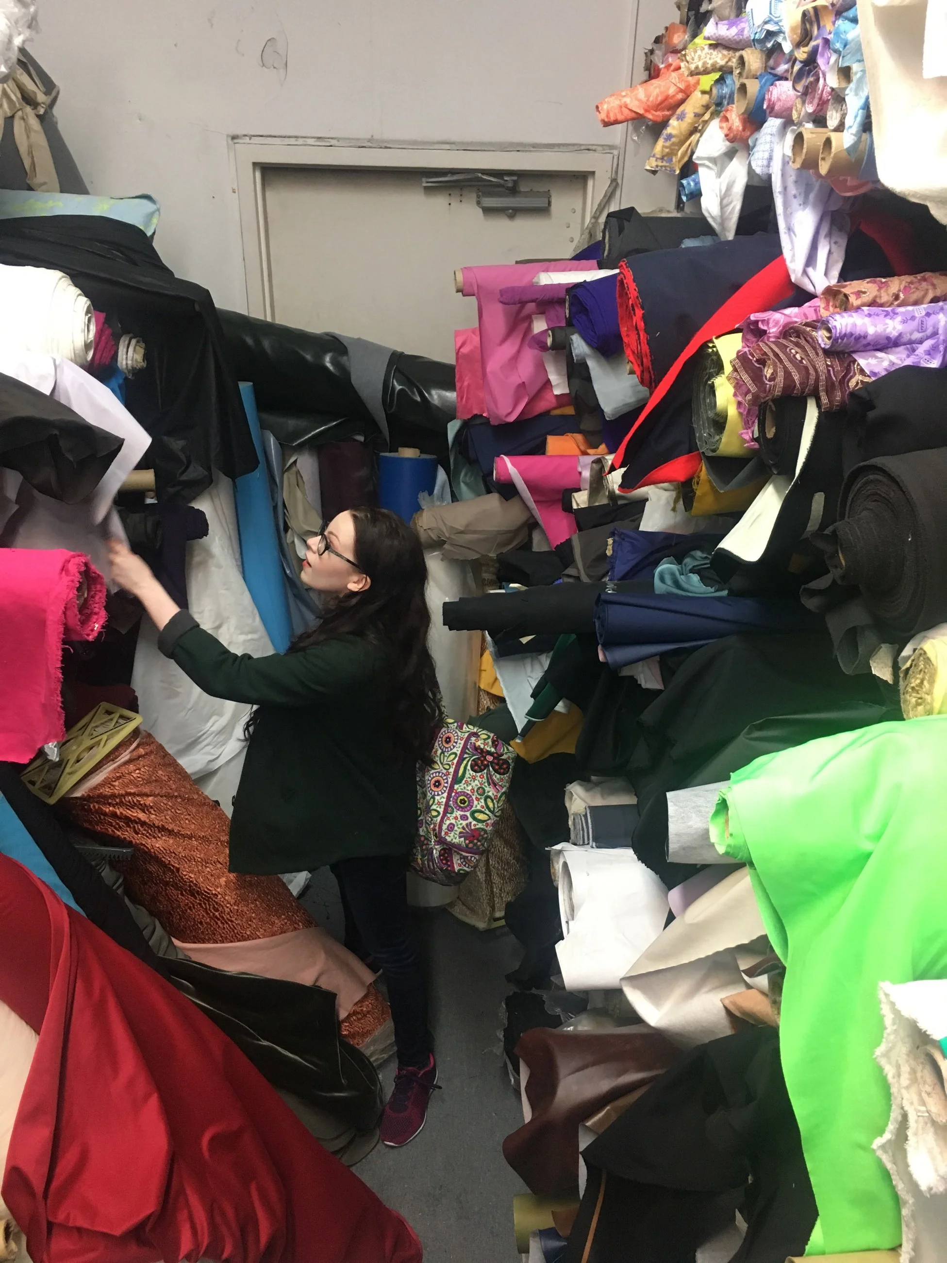 Stacked to the ceiling with fabric! My sister climbed up on a ladder to take this pic