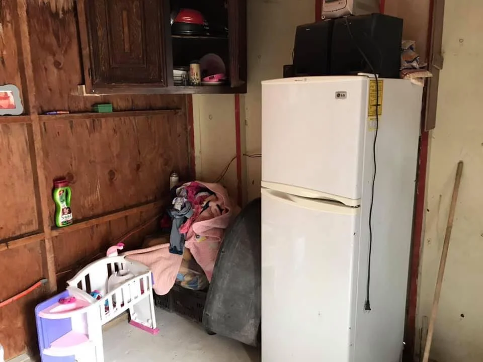 A small area inside the families home with their daughter’s toys.