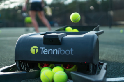 Tennibot picks up the balls for you.