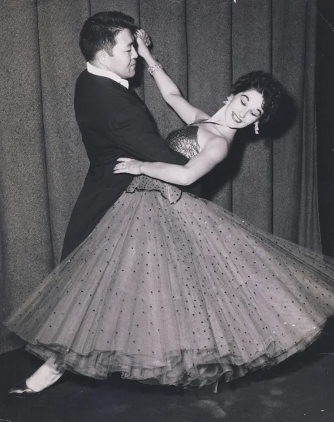 Ken Ota trained in ballroom dance with Sheila Webber-Sloan, a U.S. Dance Champion, winning awards and making television appearances.