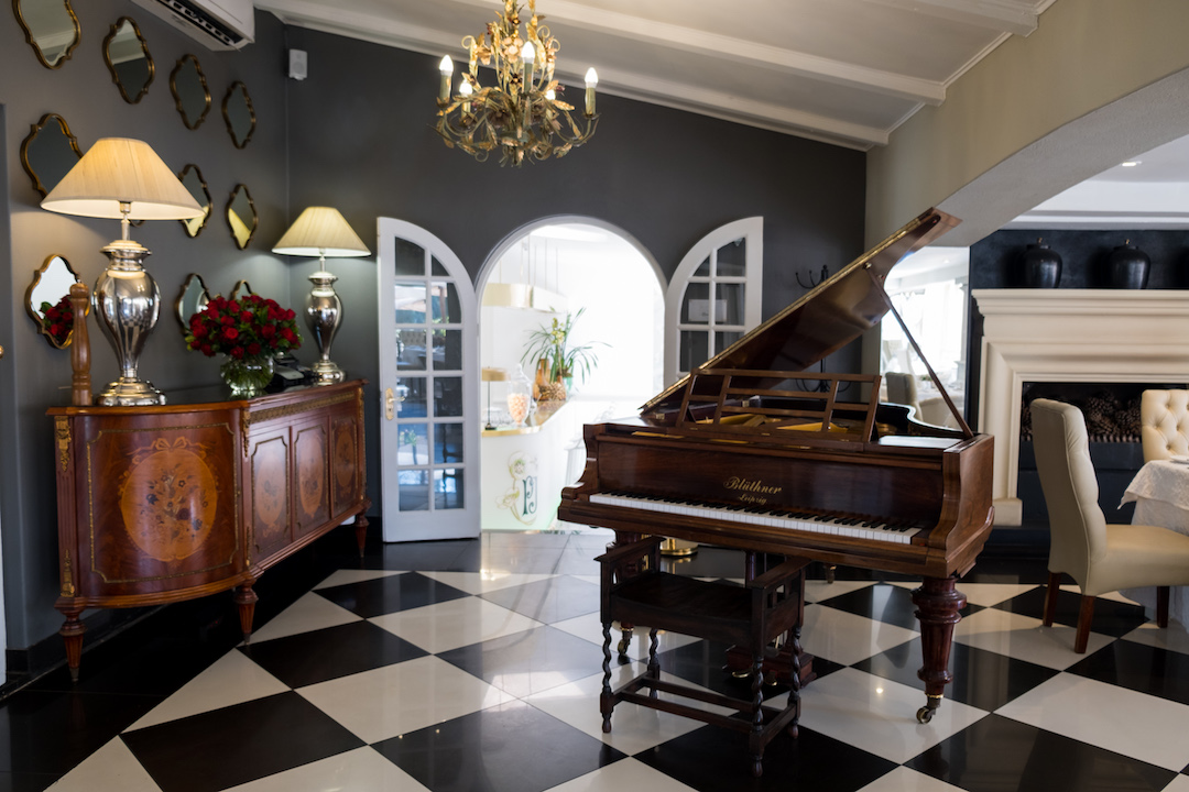 The open dining room has a piano at the entrance and Muse Champagne Room is just through that arched doorway (photo supplied)
