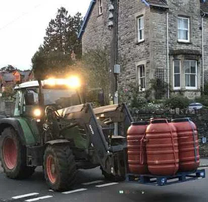 The tractor unloads the van.jpg