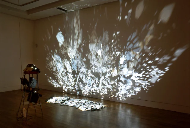 Chaos and Dreams yet to come, 2005, light projection, destroyed car mirrors, size variable