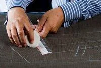 2. Drafting a Pattern: After the cutter has drafted the individual’s pattern, it is then cut out and chalked onto the cloth.