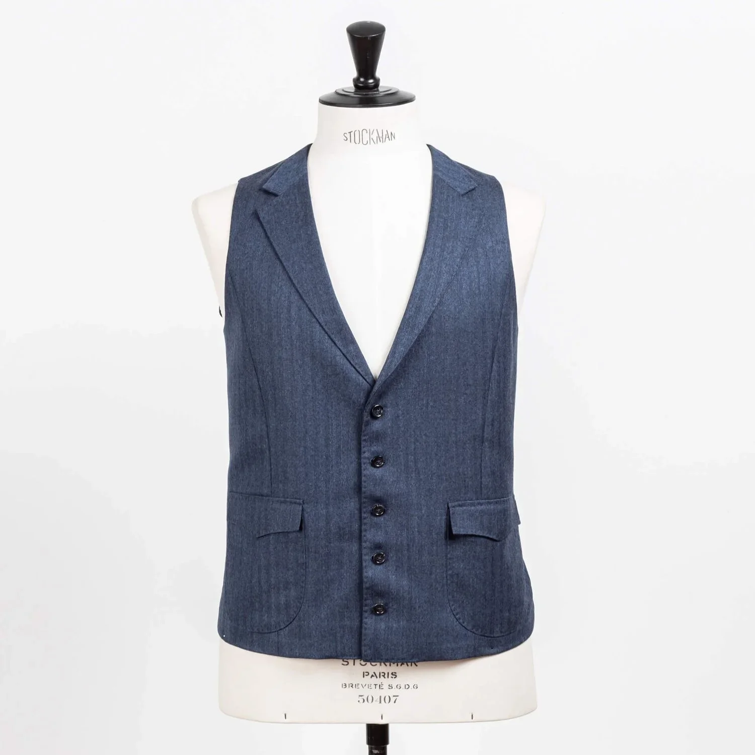Denim blauw herringbone flannel gilet met notch lapels en patch pockets