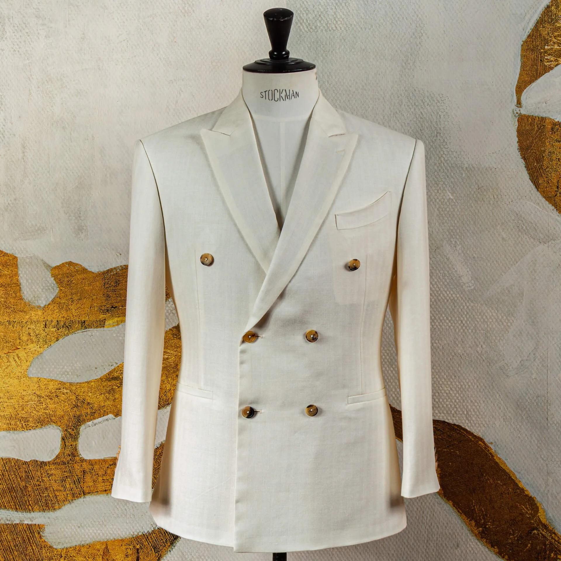 Cream double-breasted wedding suit in Italian fabric bespoke.jpg