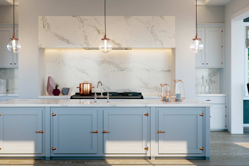 Caesarstone white and grey marble work surface with baby blue kitchen doors and copper highlights.