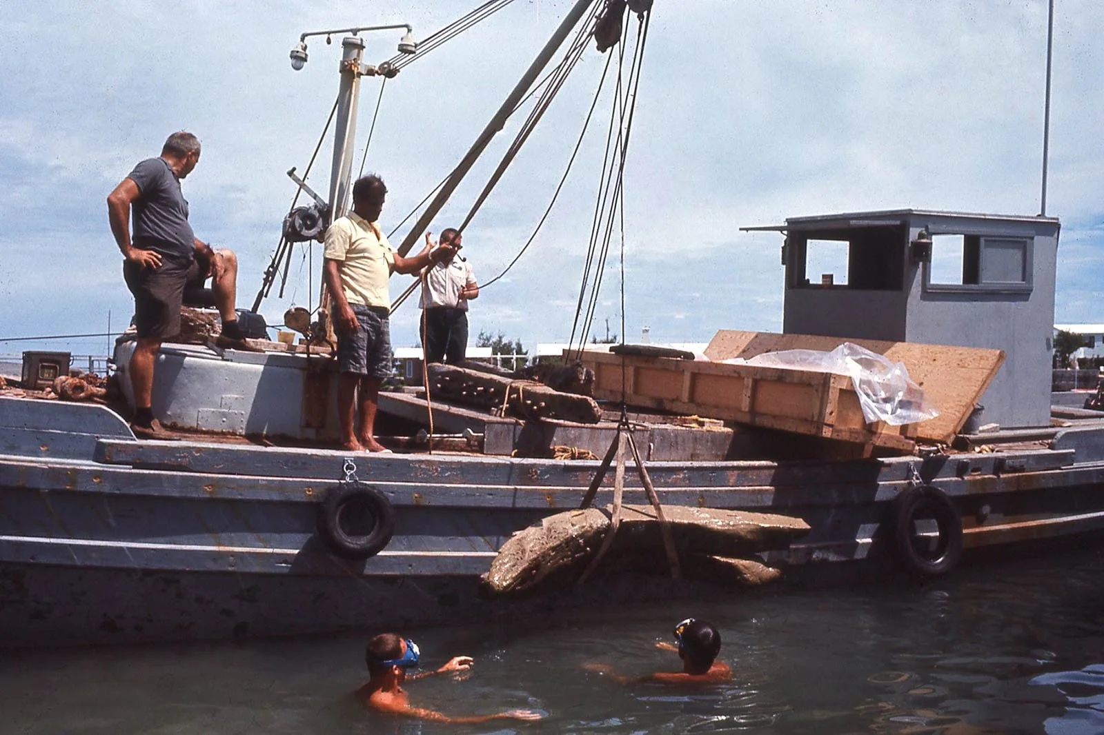Teddy and Mendel Peterson prepare timbers for shipping to the Smithsonian Institution