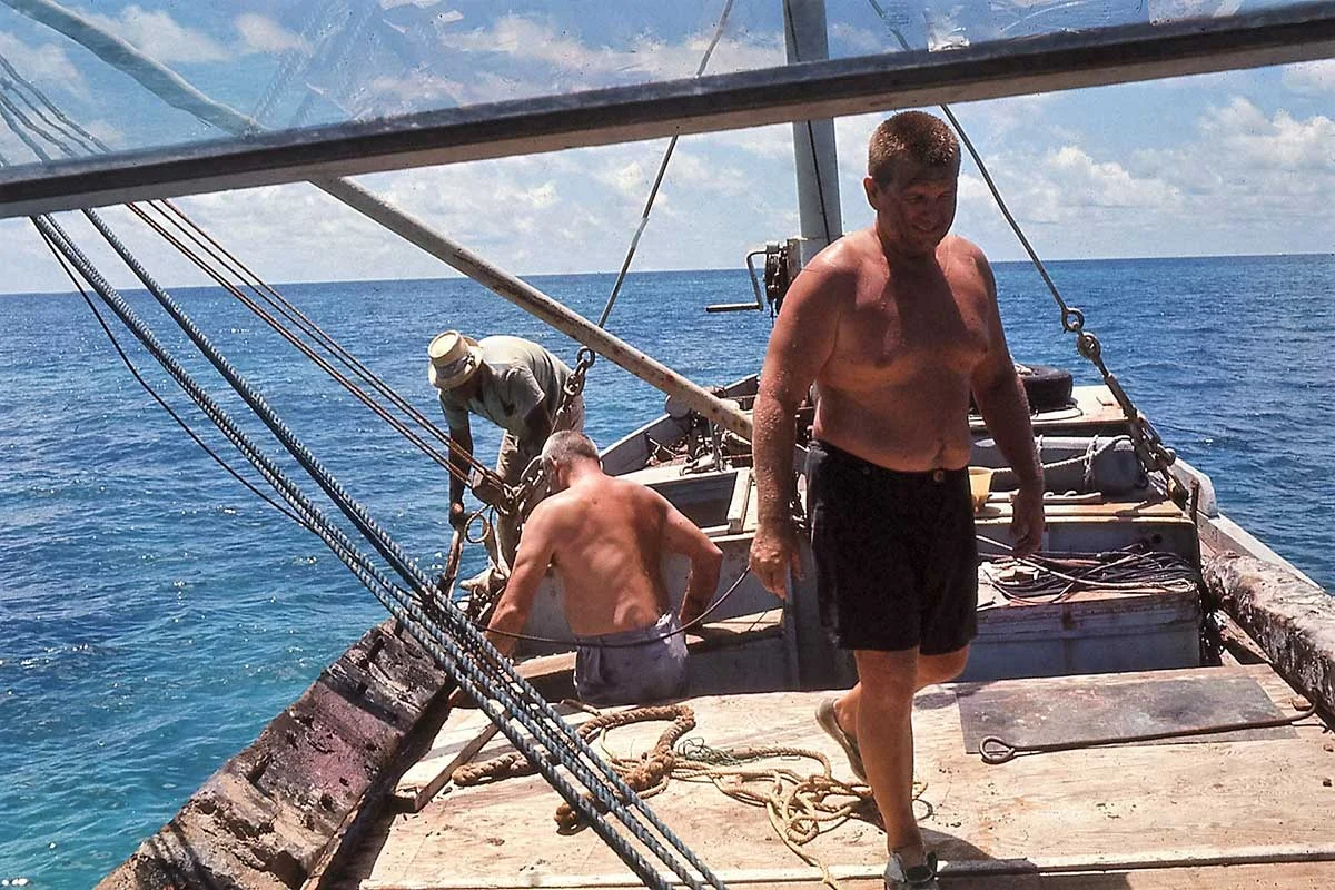 Bobby, Mendel and Teddy retrieving a plank from a wreck
