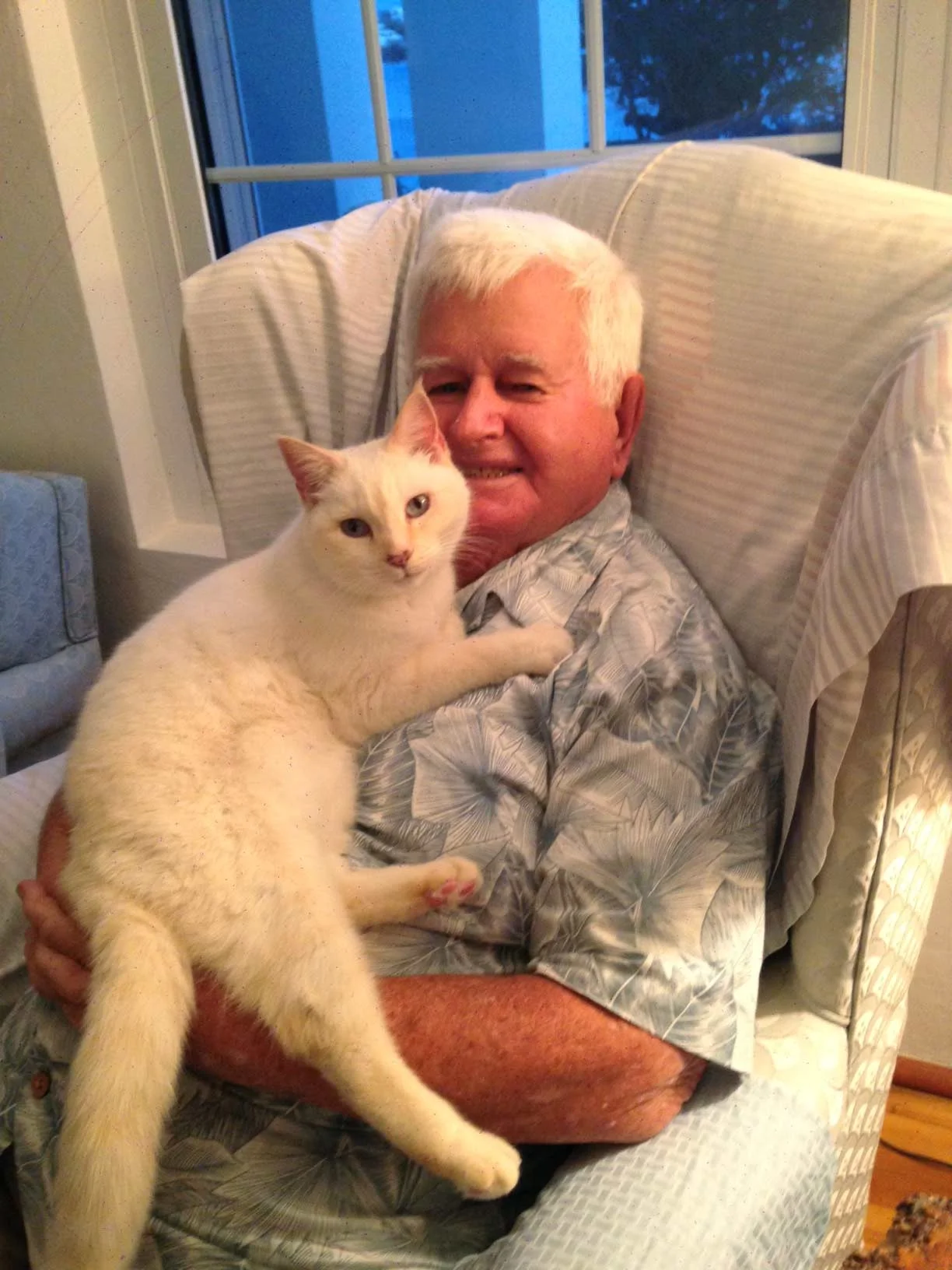 Teddy with Ginger, one of his many cats