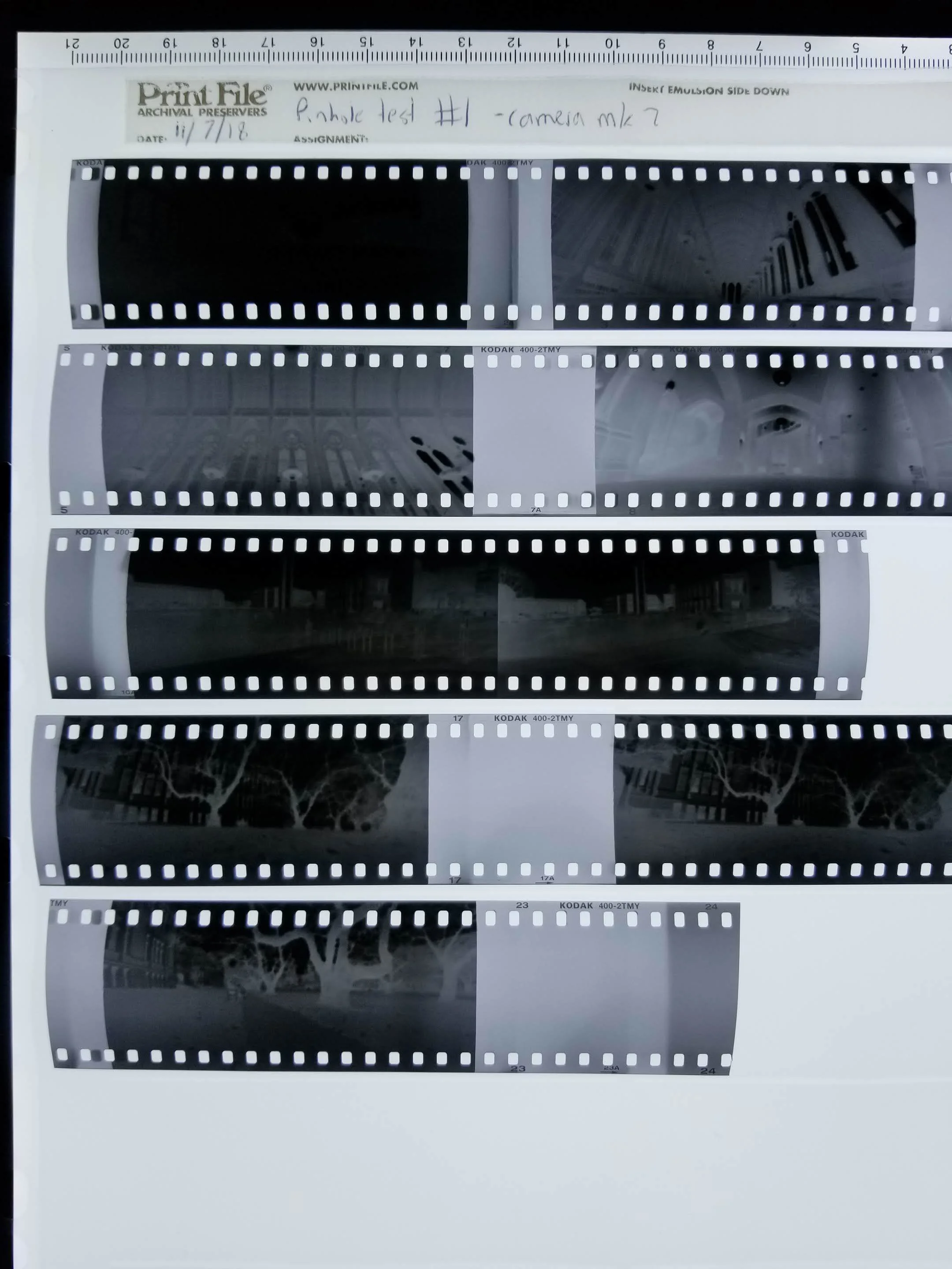 The first roll of film on my light table. Notice the light leaks and fogging visible between frames.