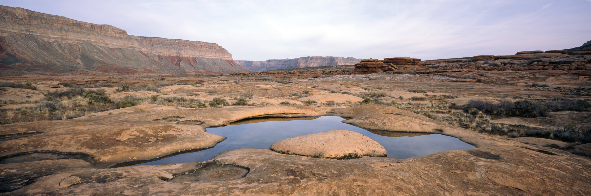  Reflections in a pot hole after sunrise, looking north up Kanab Creek. Provia 100, 1/15, f/20. 