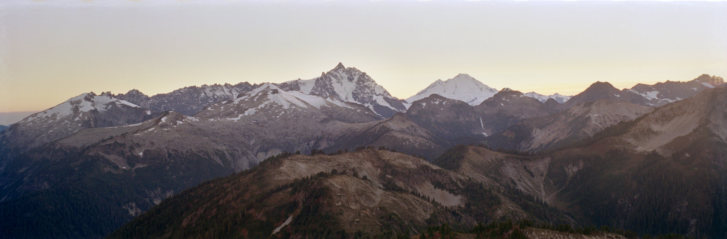  Ruth, Icy, the Jagged Ridge, Nooksack Tower, Shuksan, Baker, and Sefrit at sunset from Copper Ridge. Kodak Gold 200. 