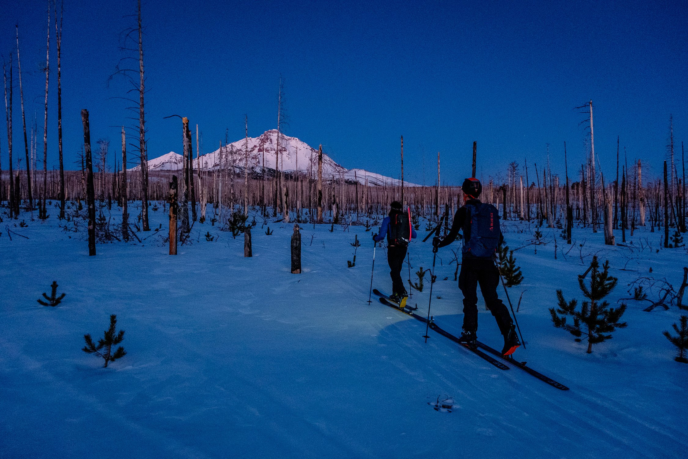  Adam and Alex on the predawn approach to North Sister ahead of long traverse of all three summits. 