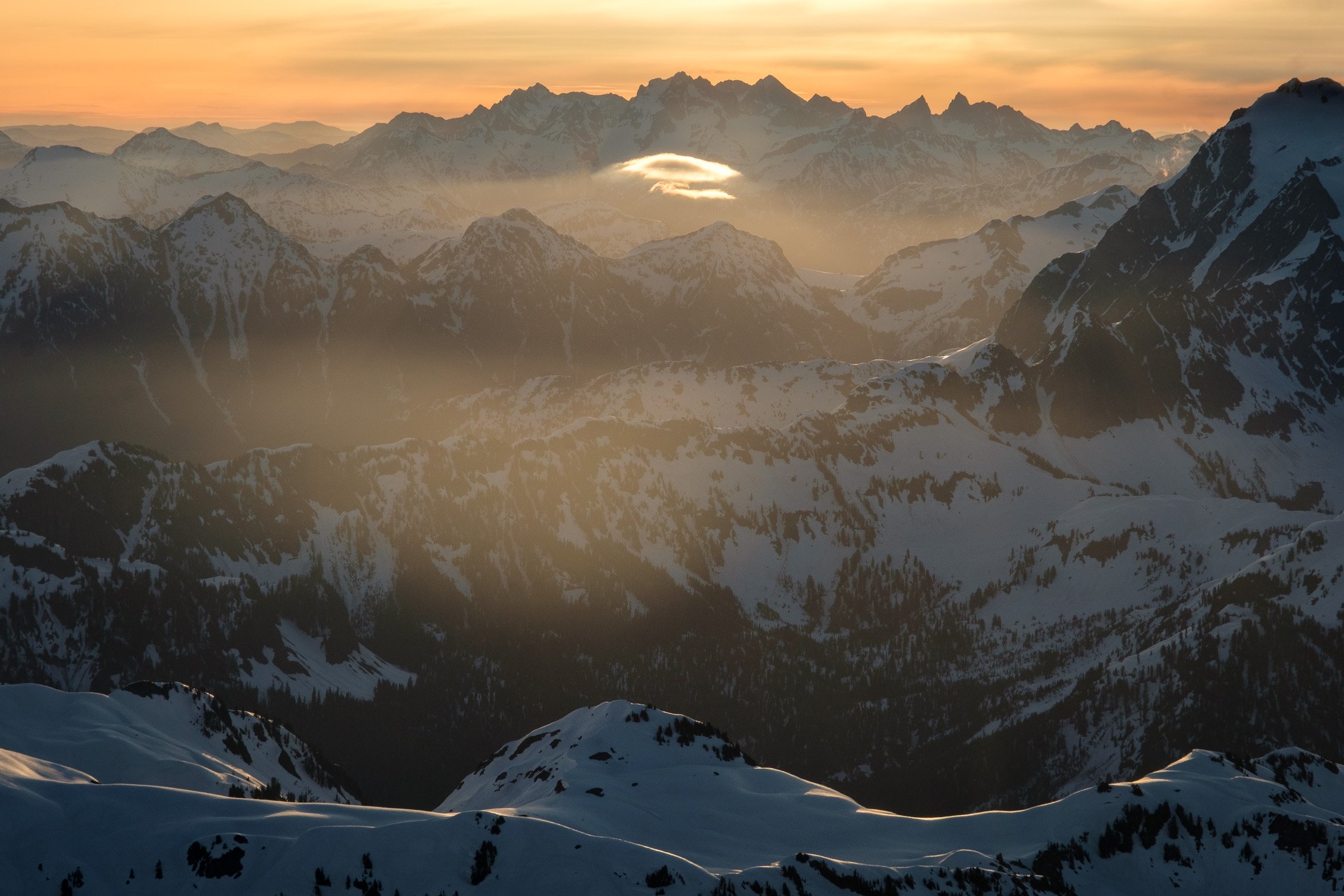  Redoubt and the Moxes within North Cascades National Park on a morning ski ascent of the Park Glacier Headwall in May. 