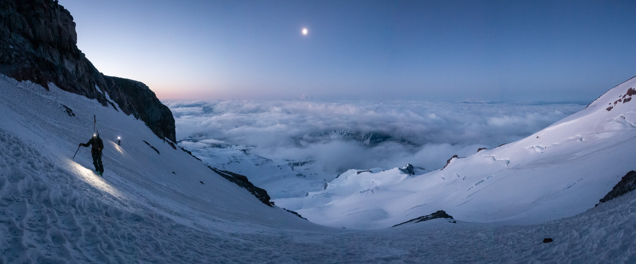  Danny and Micah climbing up the base of the Fuhrer Finger, a steep couloir on Mount Rainier, in early May. 