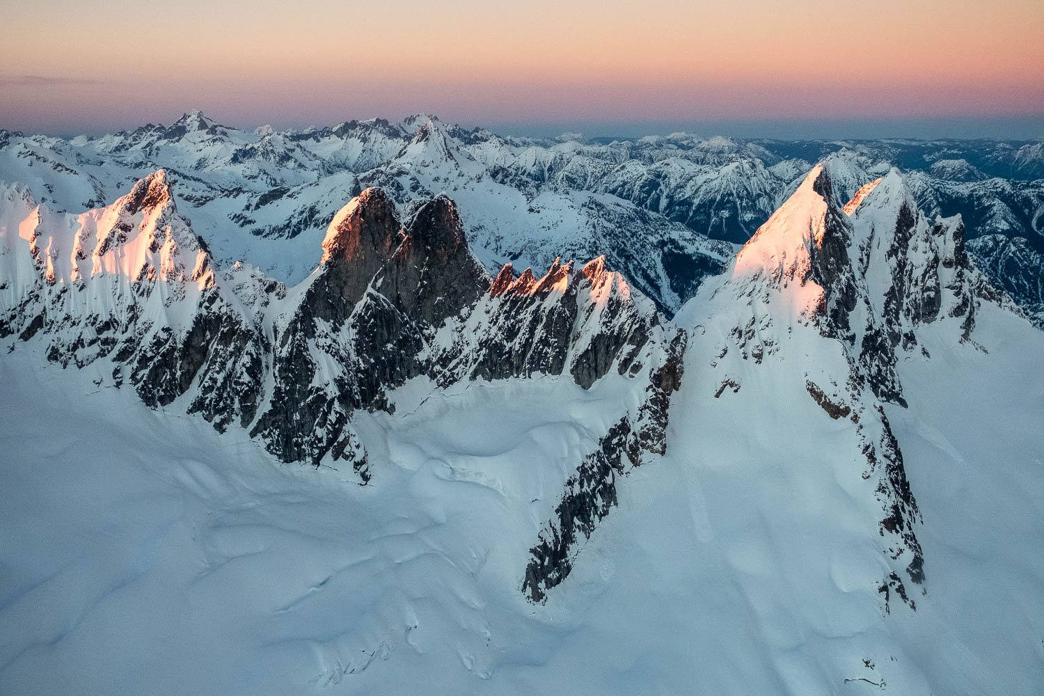  The Crescent Creek Spires: the Pyramid, Inspiration (with steep, rocky South Face) and McMillan Spires. Redoubt, the Moxes, and Spickard in distance. 