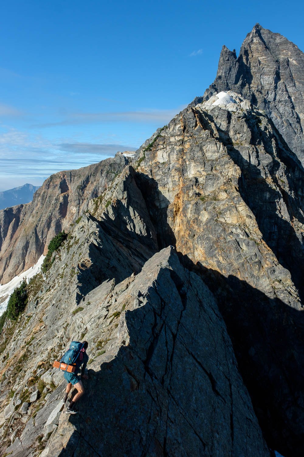  Matt crossing a knife-edge section of ridge below East MacMillan Spire, North Cascades NP, September. 