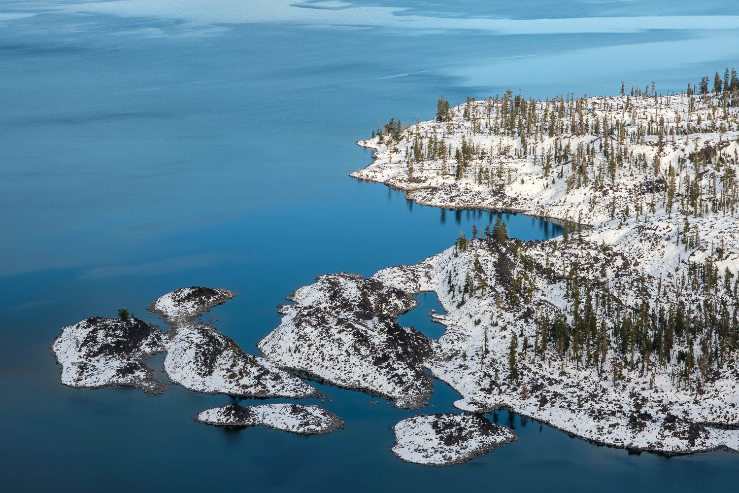  A snowcovered abstract of Wizard Island in Crater Lake, Oregon, November. 