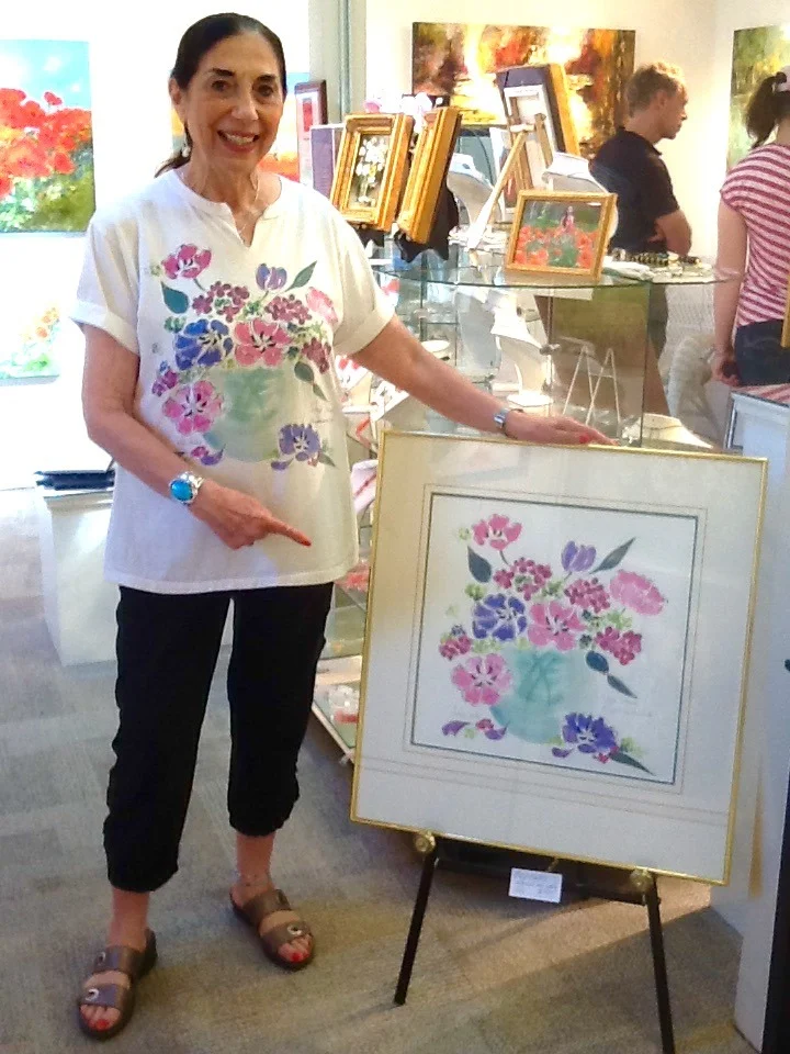 Angie Strauss matches her painting today! ‘Tulip Smiles’ is one of Angie’s vintage original paintings from 1988 that was NFS until today. The painting was an original design for Angie’s clothing line in the 80’s and 90’s. Angie just happened to be wearing the t-shirt today! 'Tulip Smiles’ 25x26 with frame $595