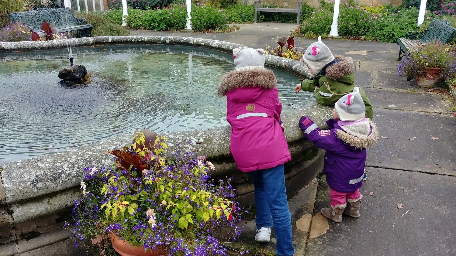 Fishing for coins in the National Trust fountain, little scroungers. 