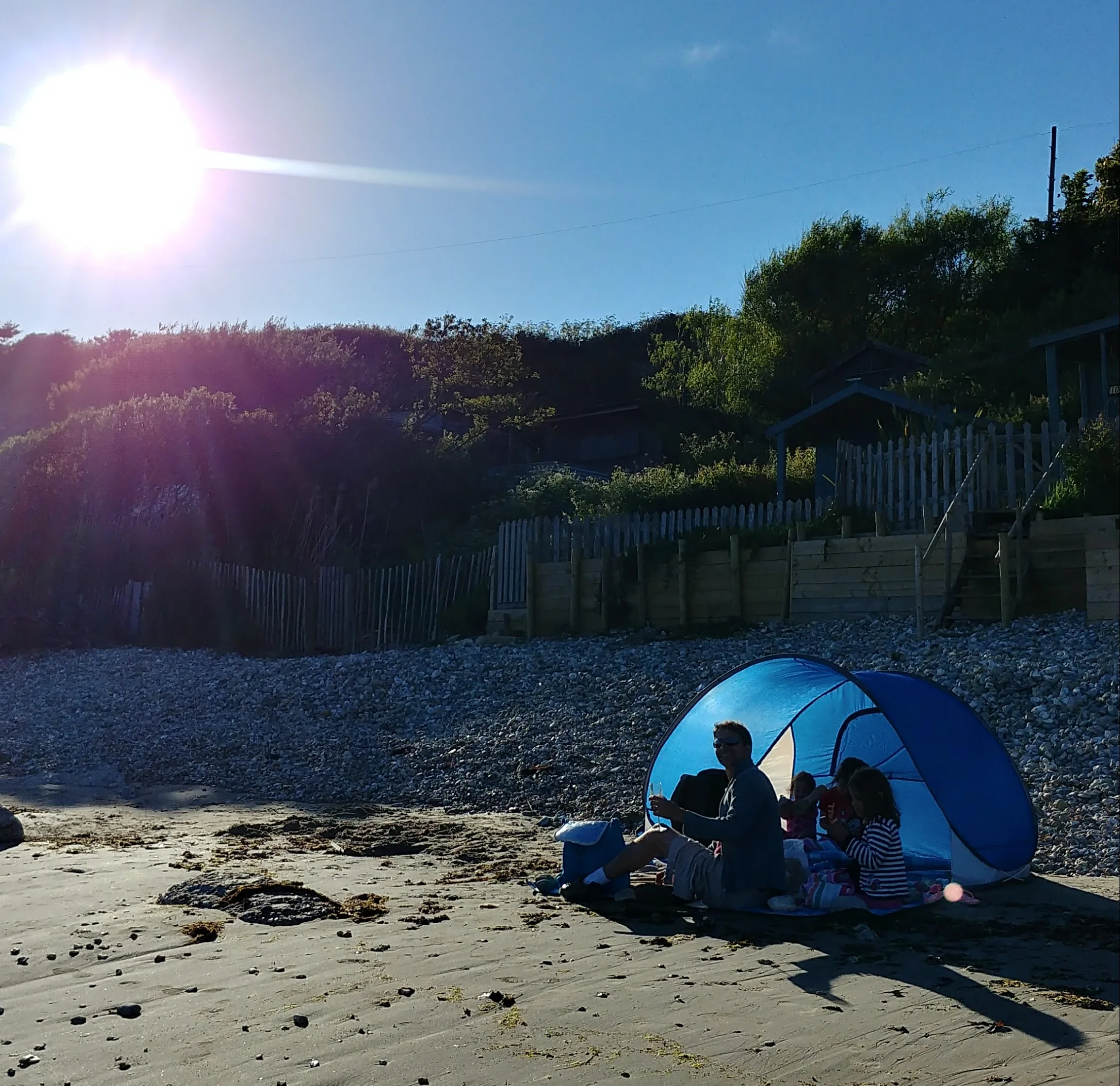 Fish, chips and prosecco on Forelands beach at sunset. 