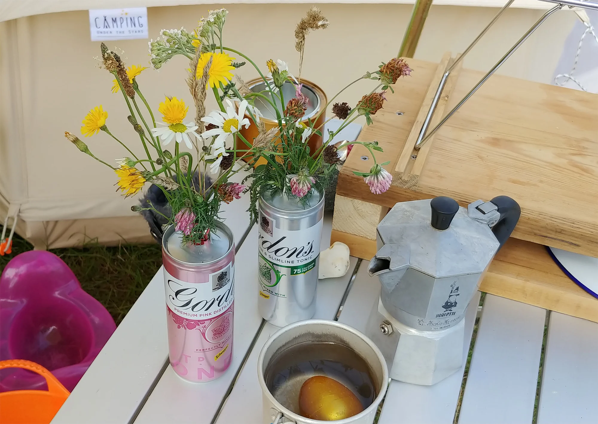 Wildflowers in gin tin vases :-) Plus a golden dinosaur egg, obviously.