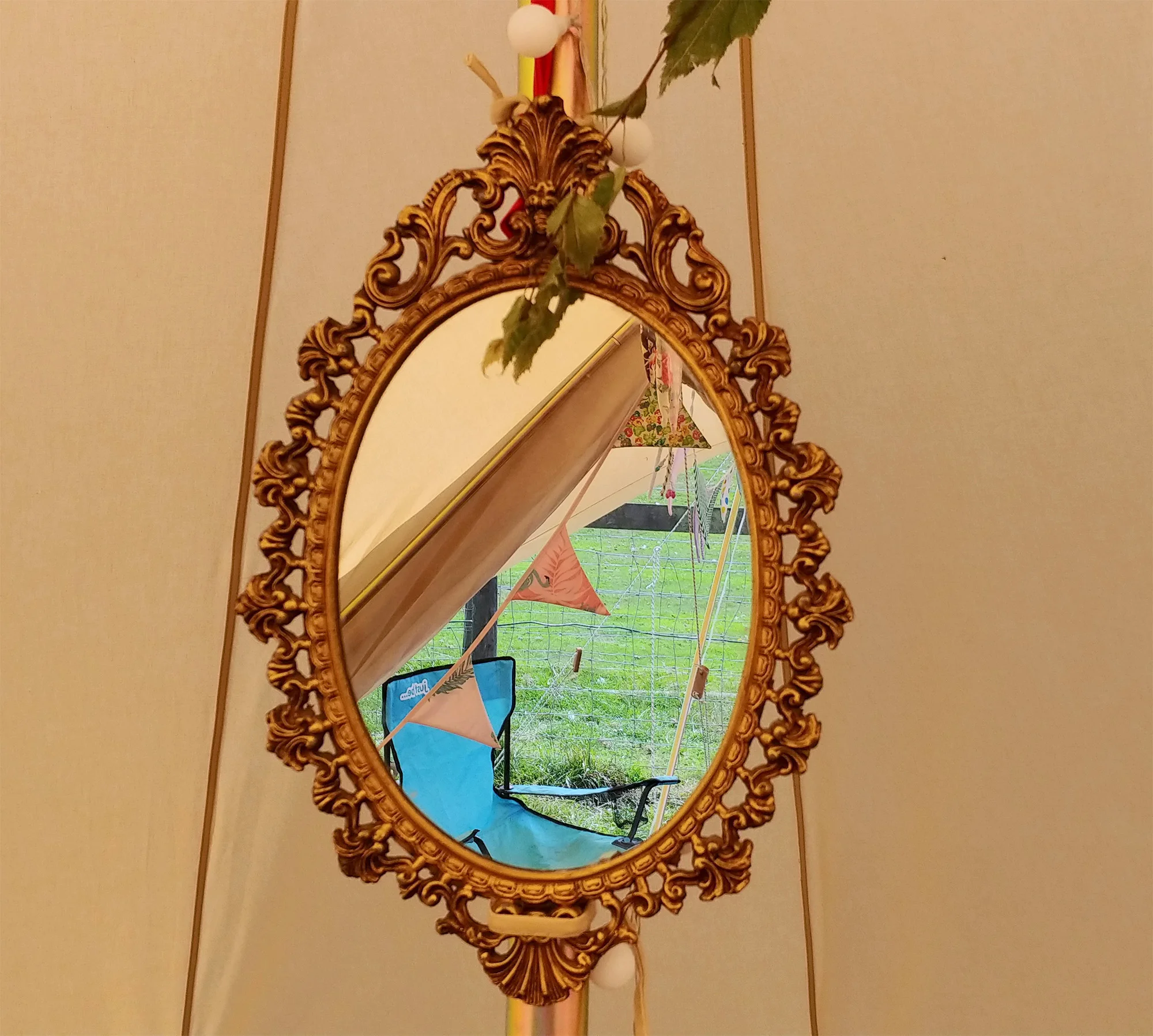 Suspending a mirror from the centre pole is genuinely practical for getting ready in the morning. If it happens to be gilt and antique style, all the better :-)