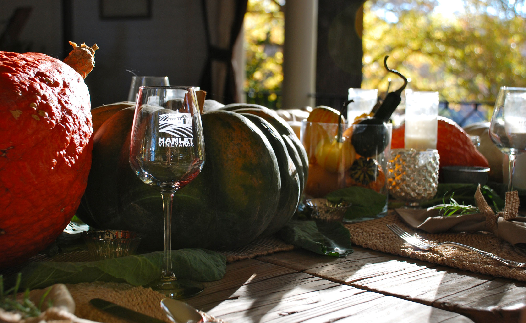 Hamlet Vineyards Wine Tasting Glass on Table Autumn Scene