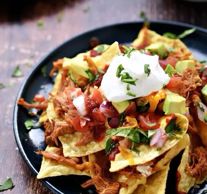 Sunday's Special is a Pulled Pork Nacho Bowl with all the Trimmings!