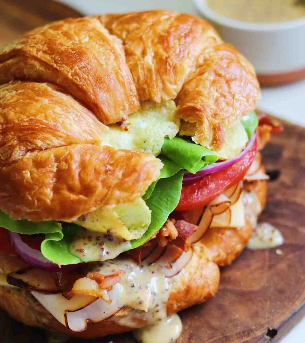 Sunday's Special is a Turkey & Creamed Brie Croissant with Rt.11 Chips & Slaw