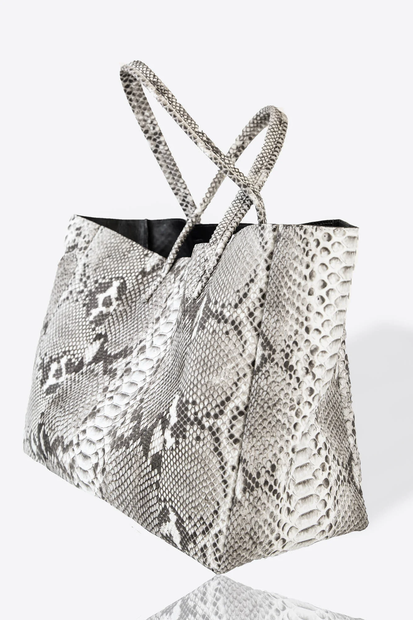 Front picture of python tote hand bag crafted with premium materials and genuine leather. Natural color. Elevating every look.