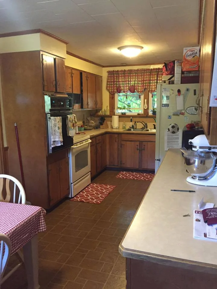 You can catch a glimpse of their kitchen table - right in the middle of the kitchen prep area. These homeowners wanted more space in their kitchen, especially for occasions when they entertain.