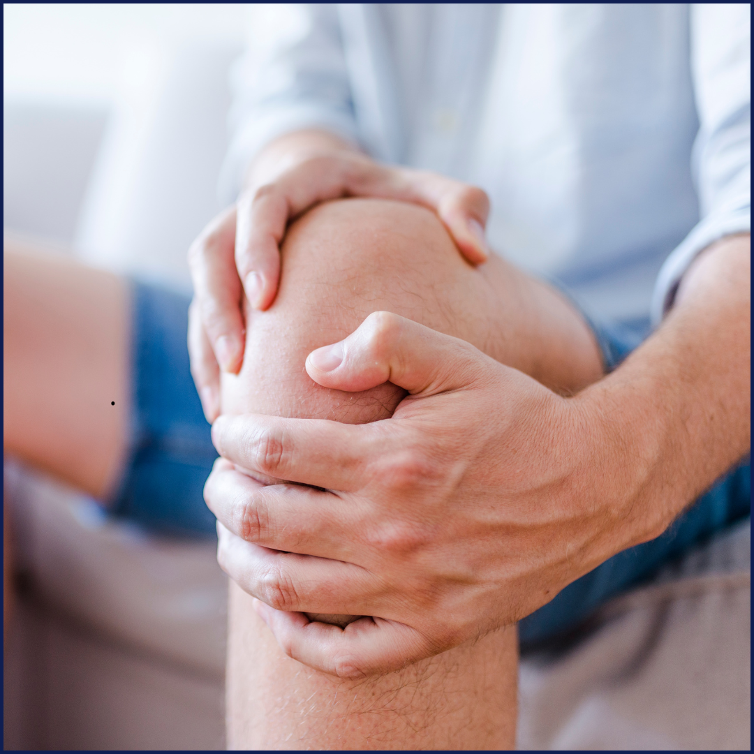 close up of male holding his knee