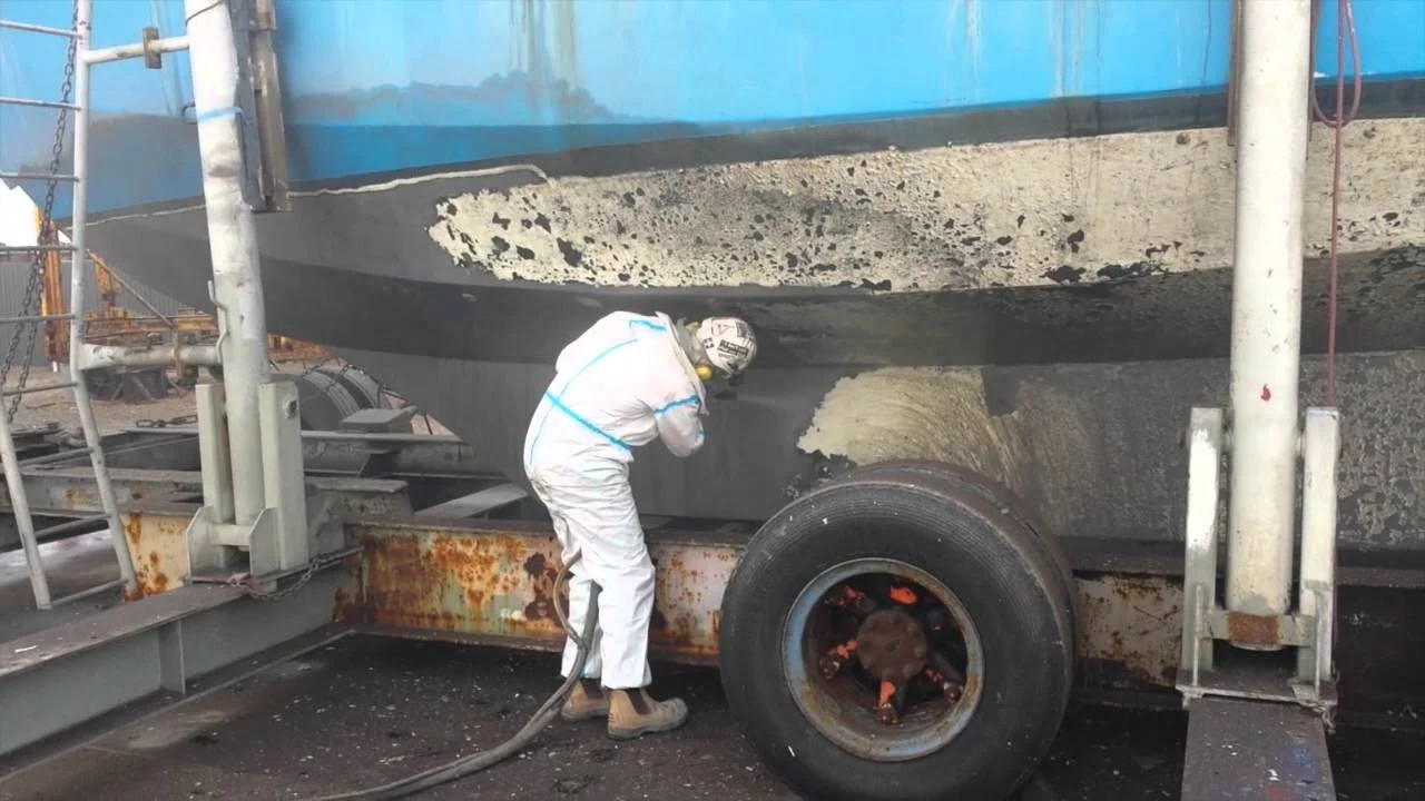 Dustless blasting on the dry dock. 