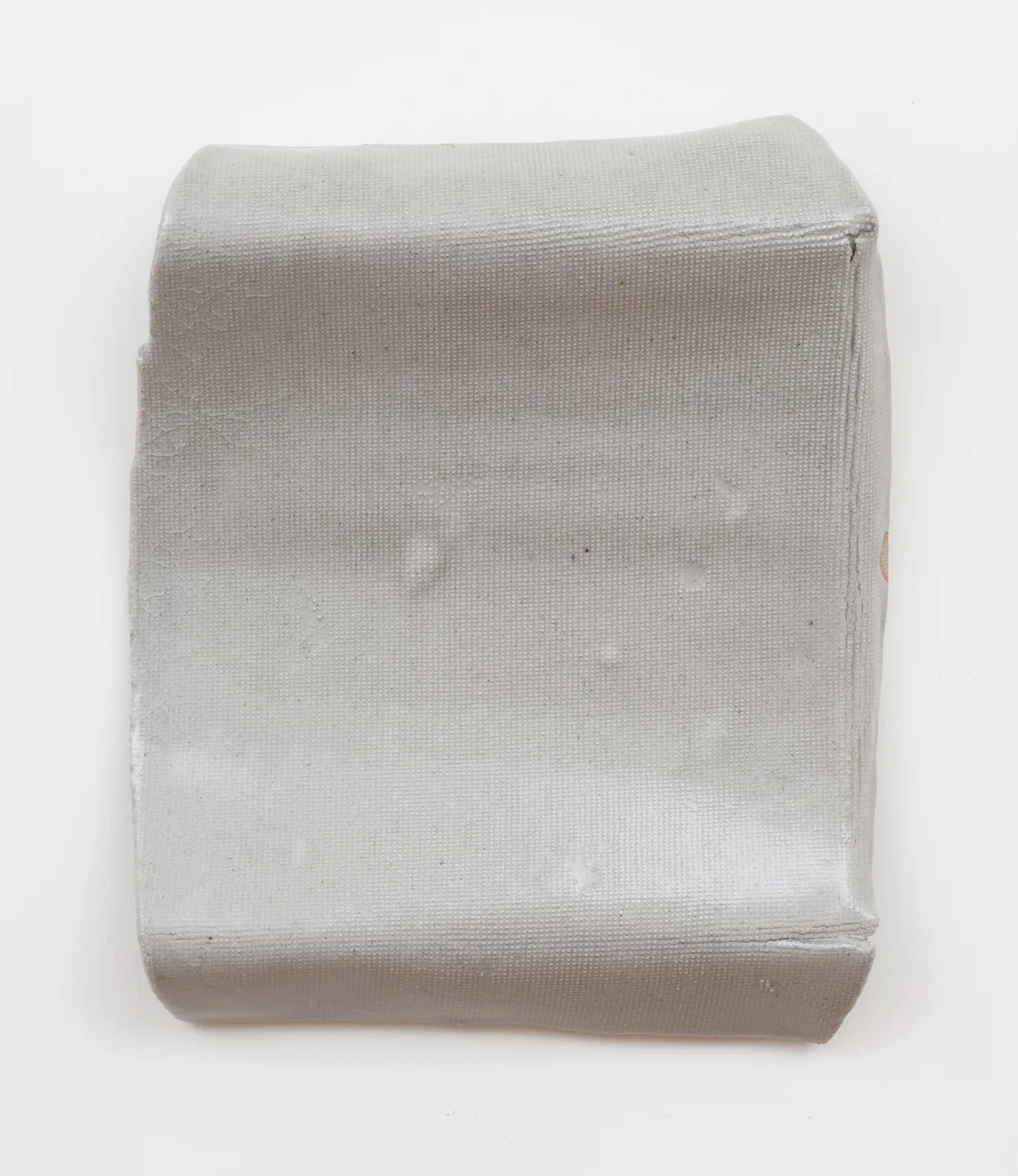 Untitled, 2012.&nbsp;Porcelain, transparent glaze. (9 x 8 x 1.5 inches)&nbsp;