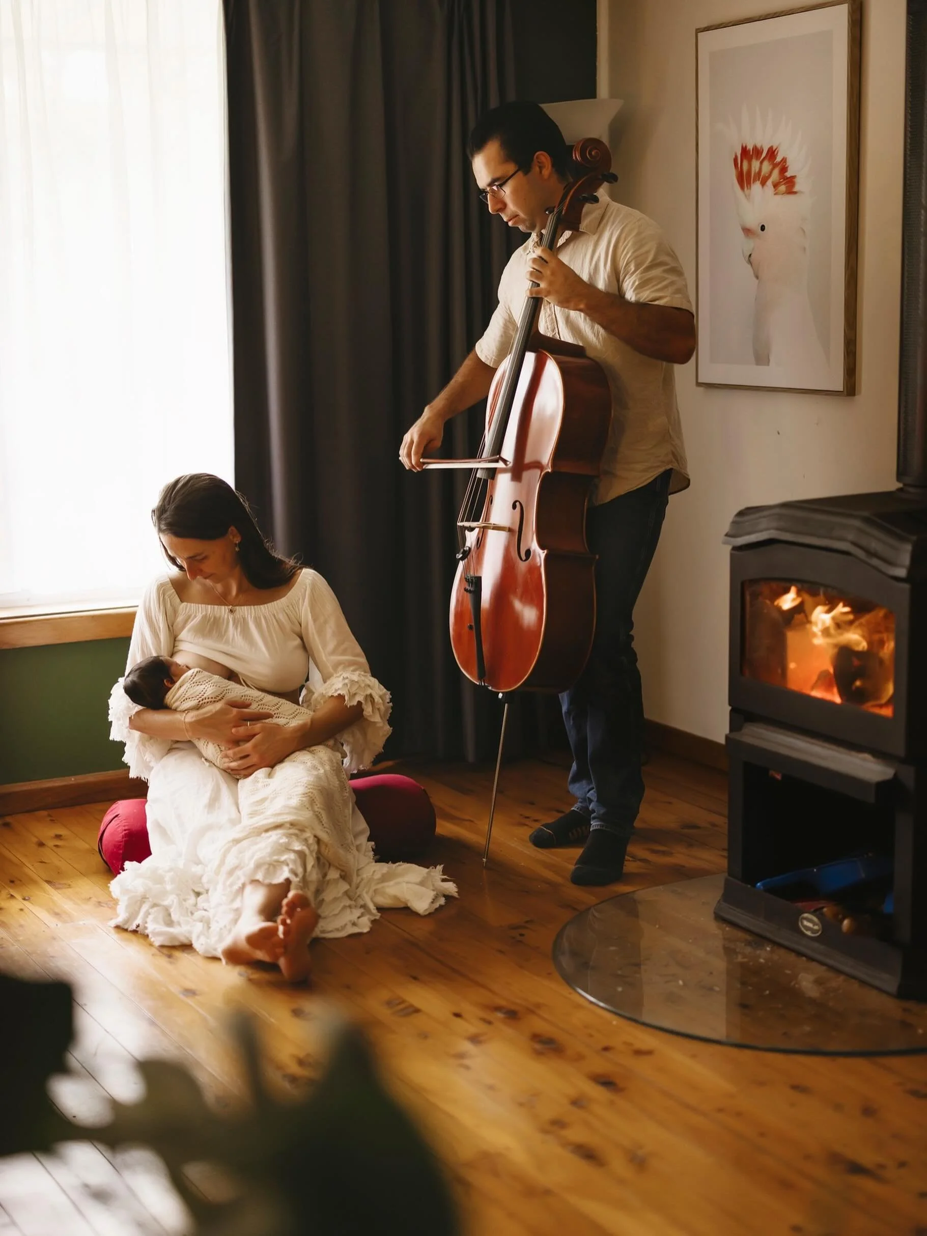 This cosy in-home newborn session was filled with warm cuddles, and the comforting crackle of the fireplace glowing in the background. The fire along with the cello playing brought such a calm and intimate feeling to the space &mdash; creating the pe